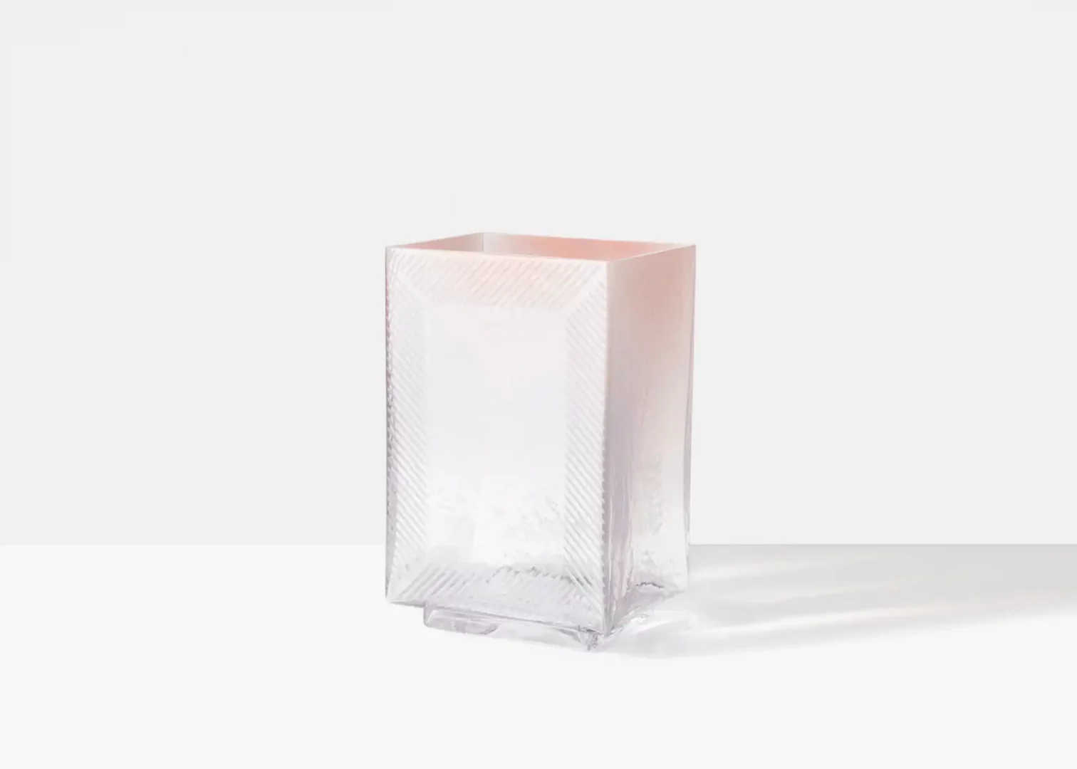 Textured glass vase on white background.
