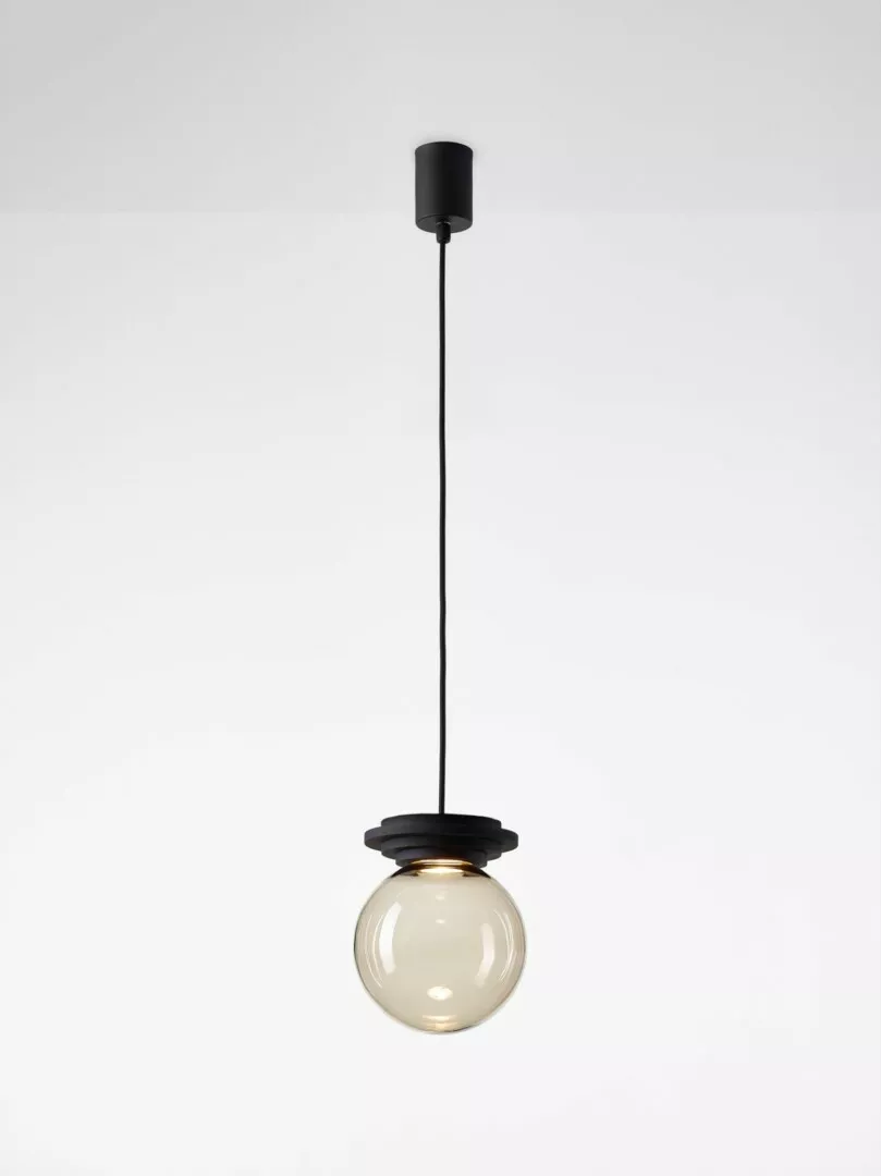 Minimalist pendant light with a round bulb.