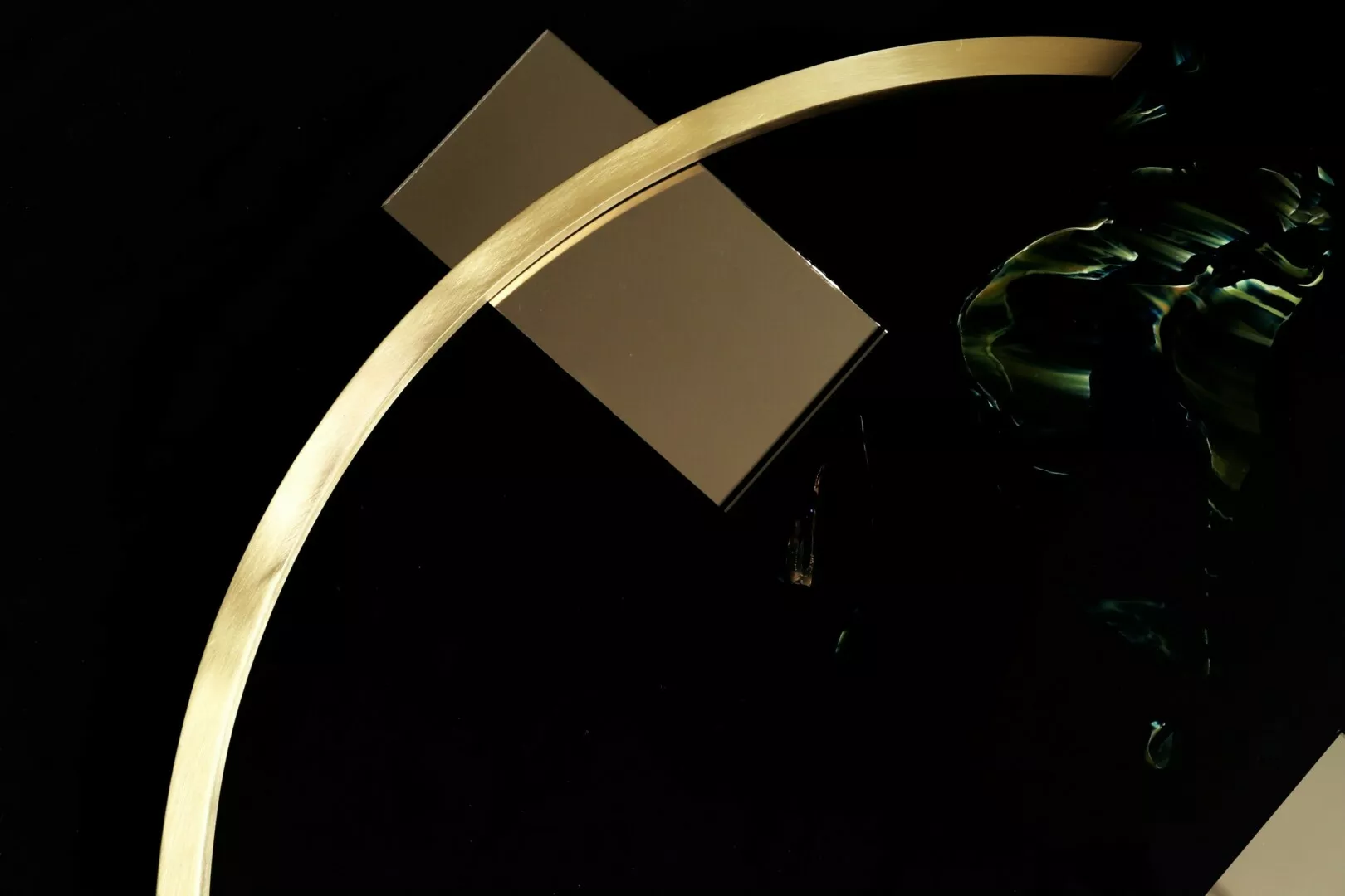 Abstract golden curve with floating metallic squares, dark background.
