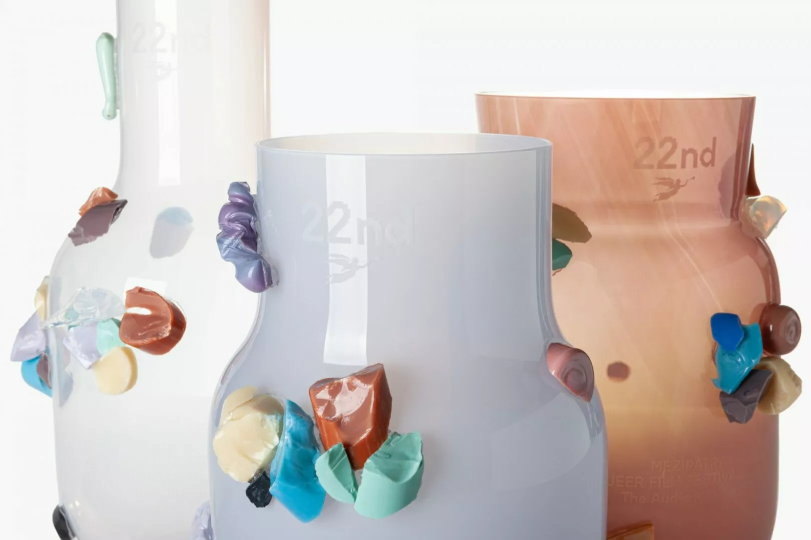 Colorful abstract vases with artistic glass appliques.