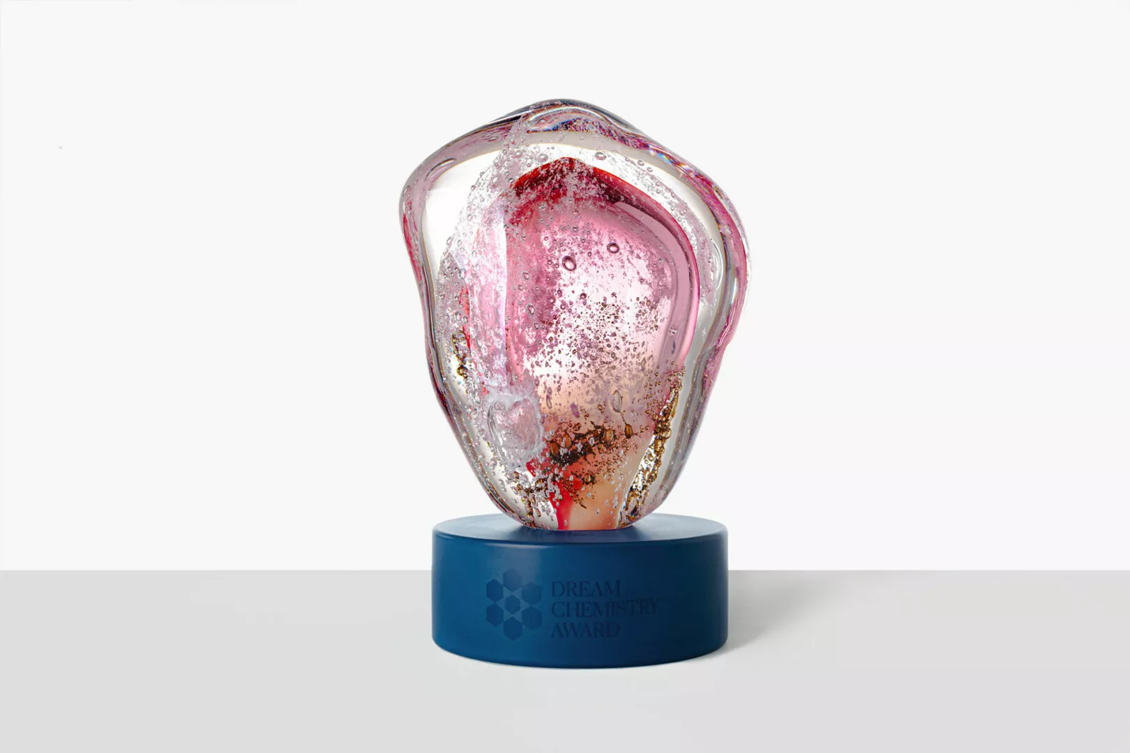 Dream Chemistry Award glass trophy on blue base.