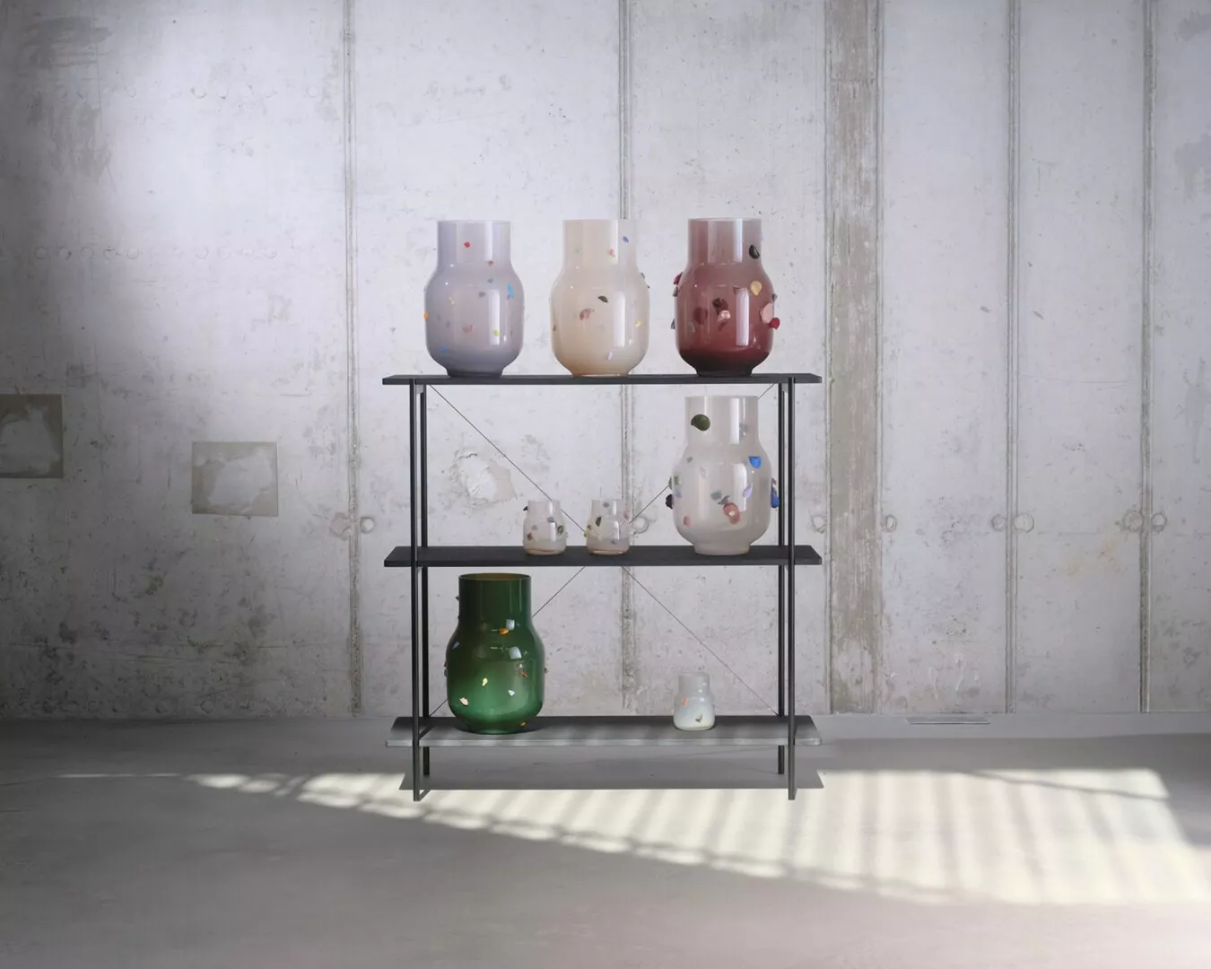 Modern vases on shelf in minimalist concrete room.