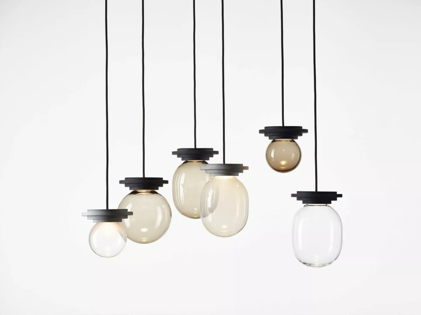 Five hanging lights with black fixtures and clear bulbs.