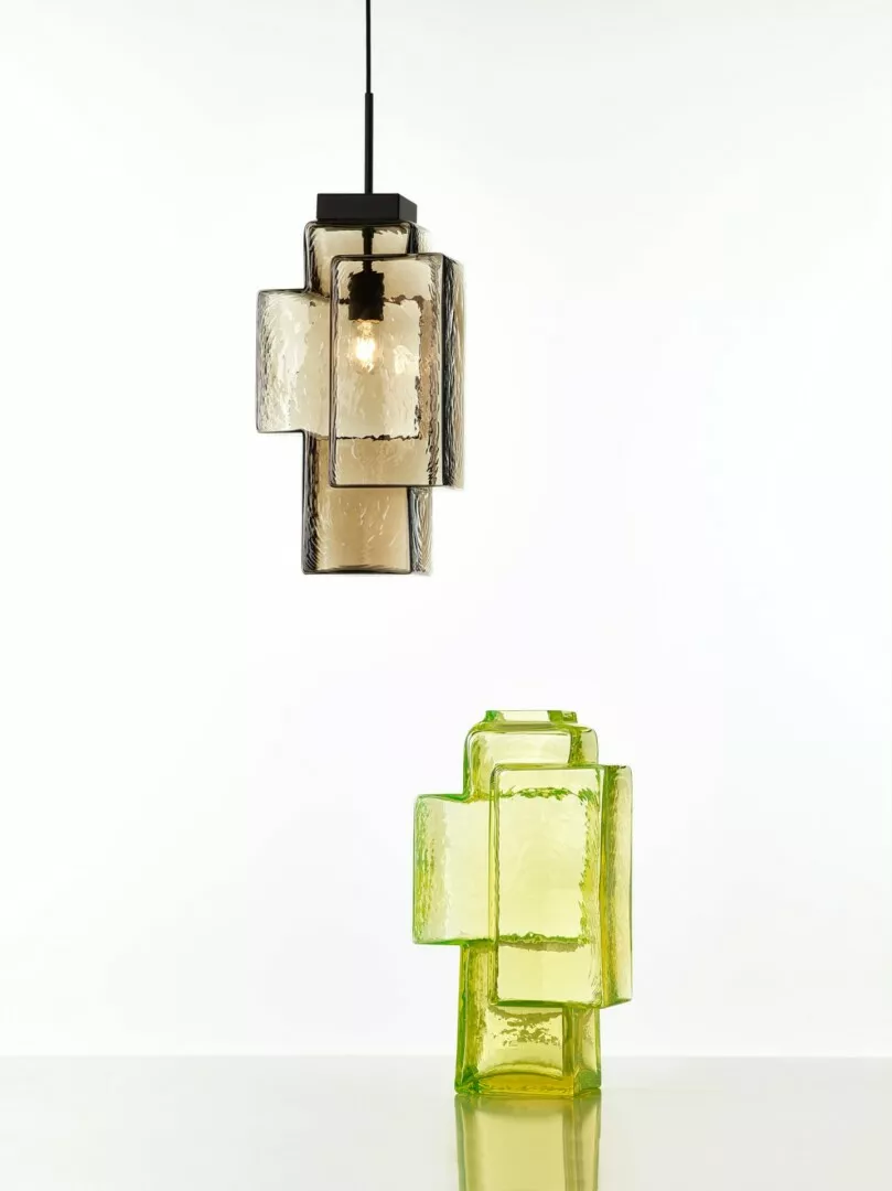 Modern amber and green glass pendant lights.