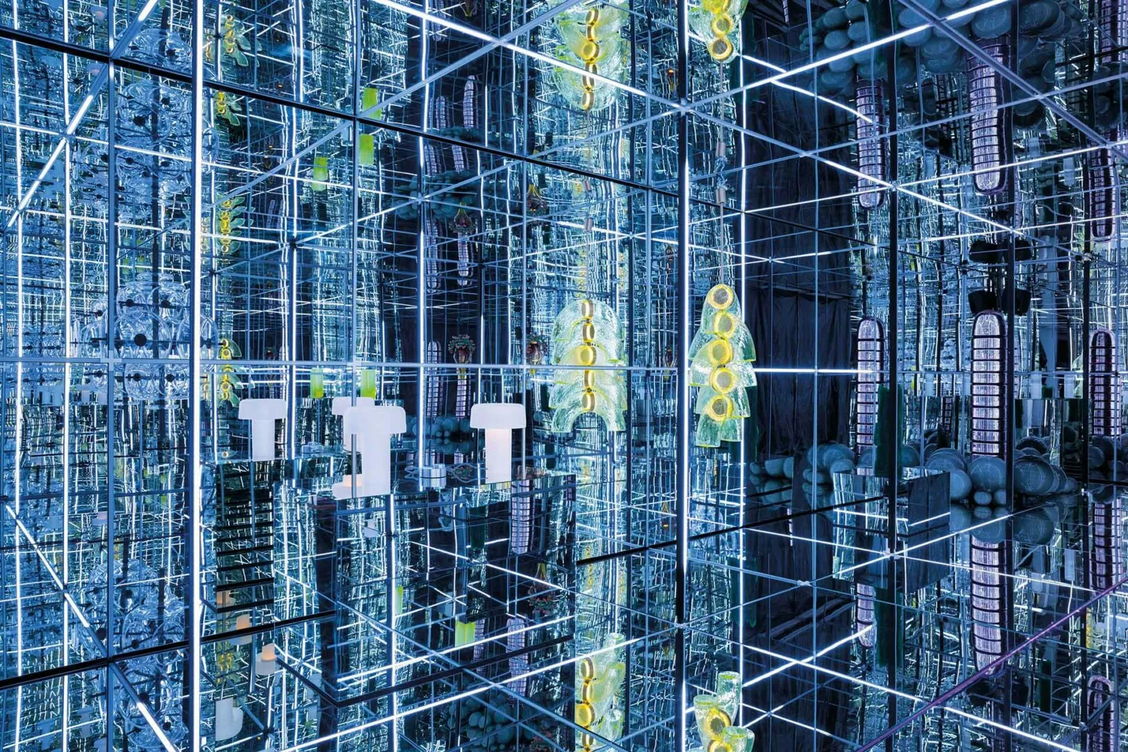 Futuristic industrial interior with reflective surfaces and green accents.