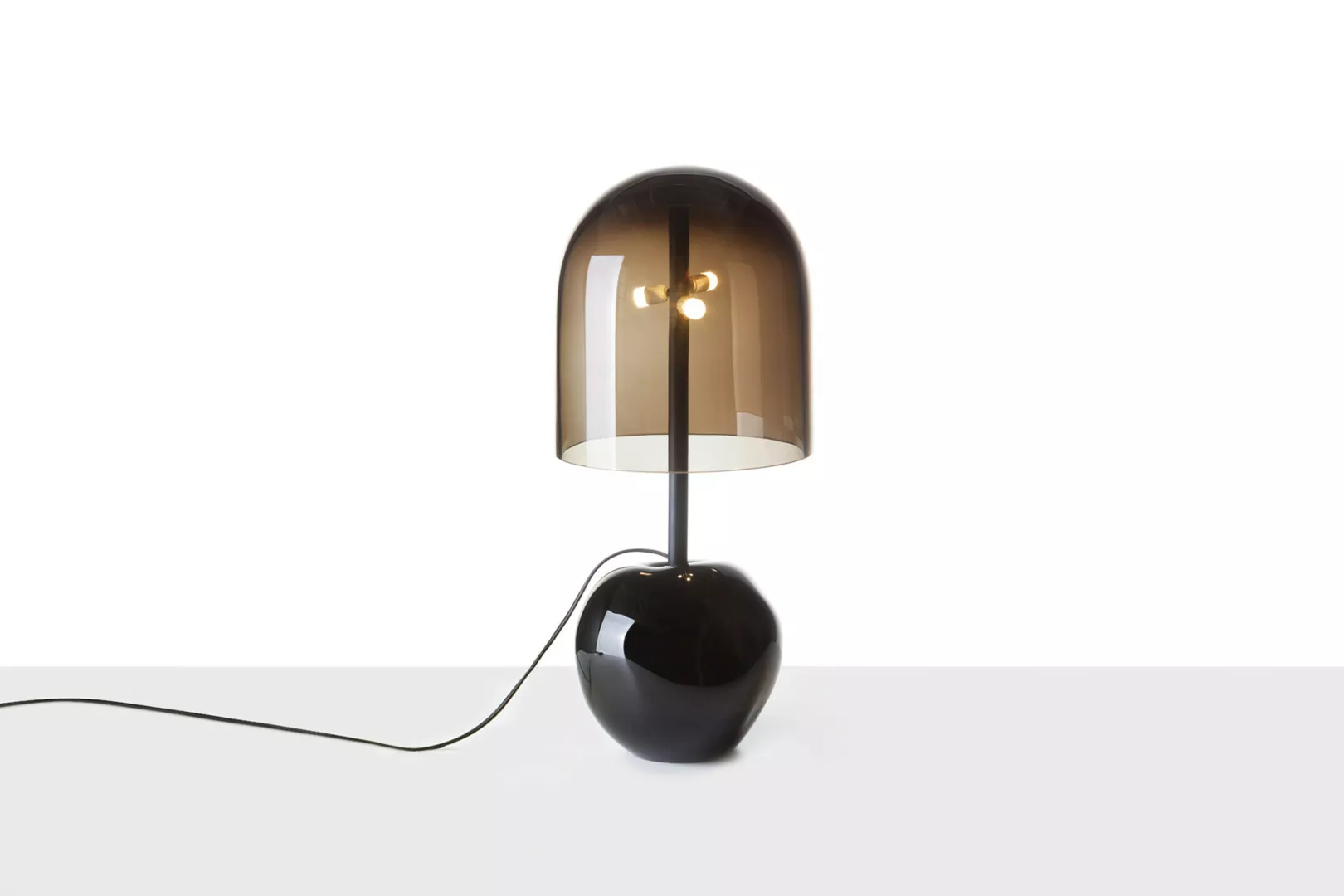 Modern black dome-shaped table lamp on white background