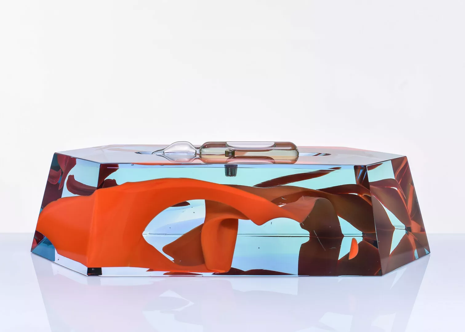 Colorful abstract acrylic sculpture with reflective surfaces.