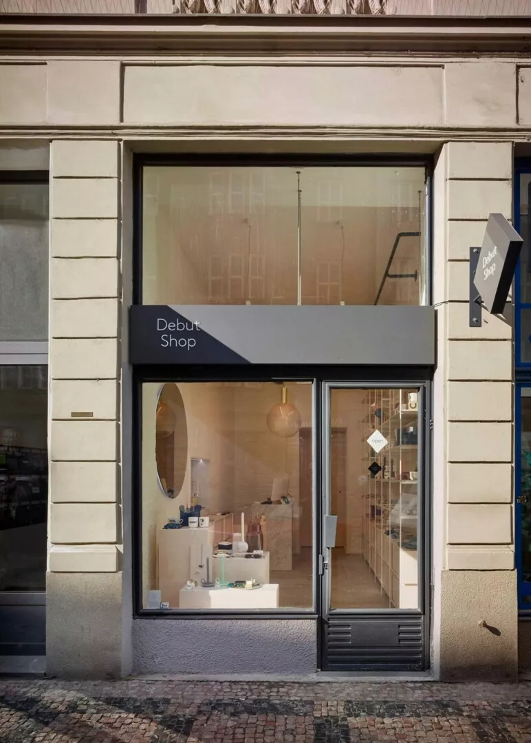 Debut Shop exterior, modern storefront with glass door.