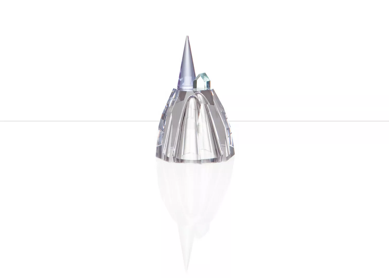 Crystal perfume bottle with reflective surface.