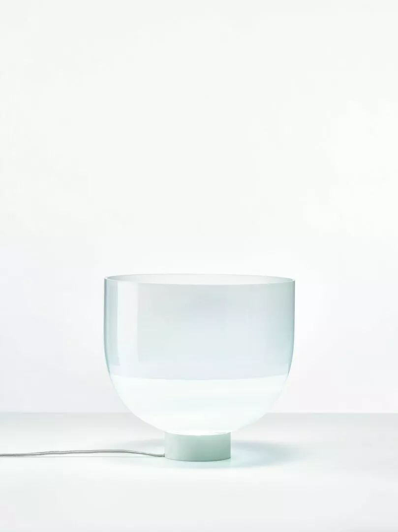 Clear glass bowl lamp on white background.