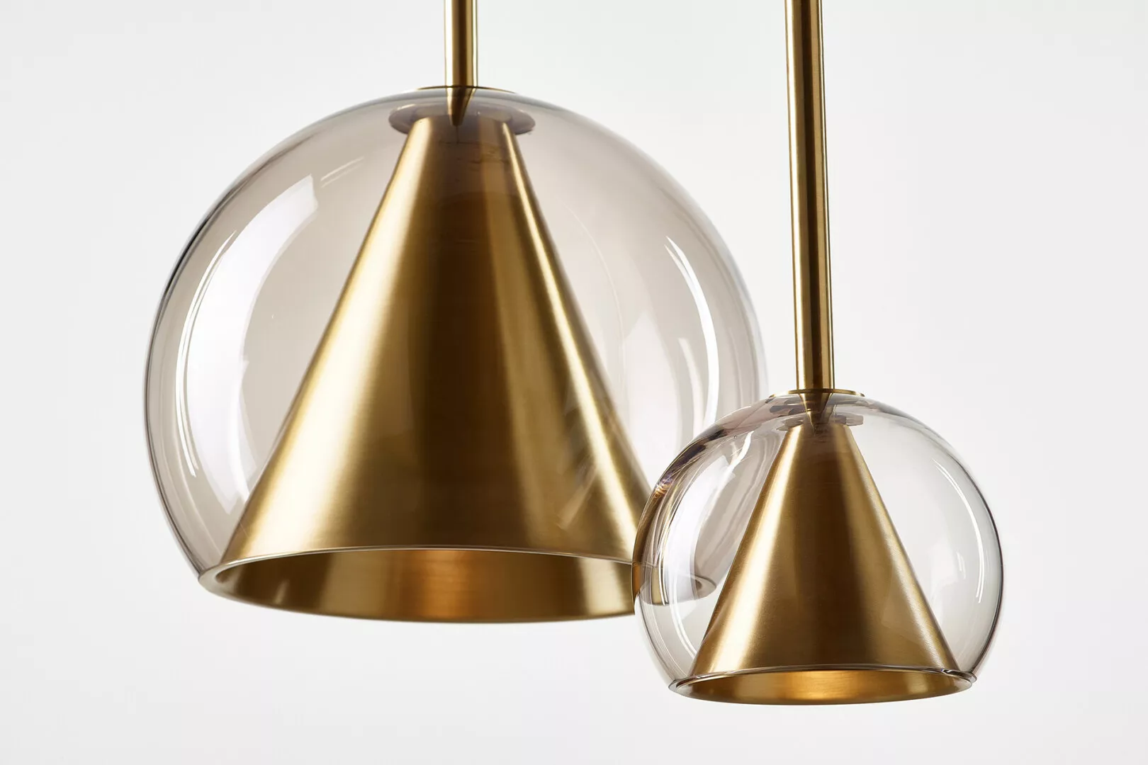 Modern gold and clear glass pendant lights.