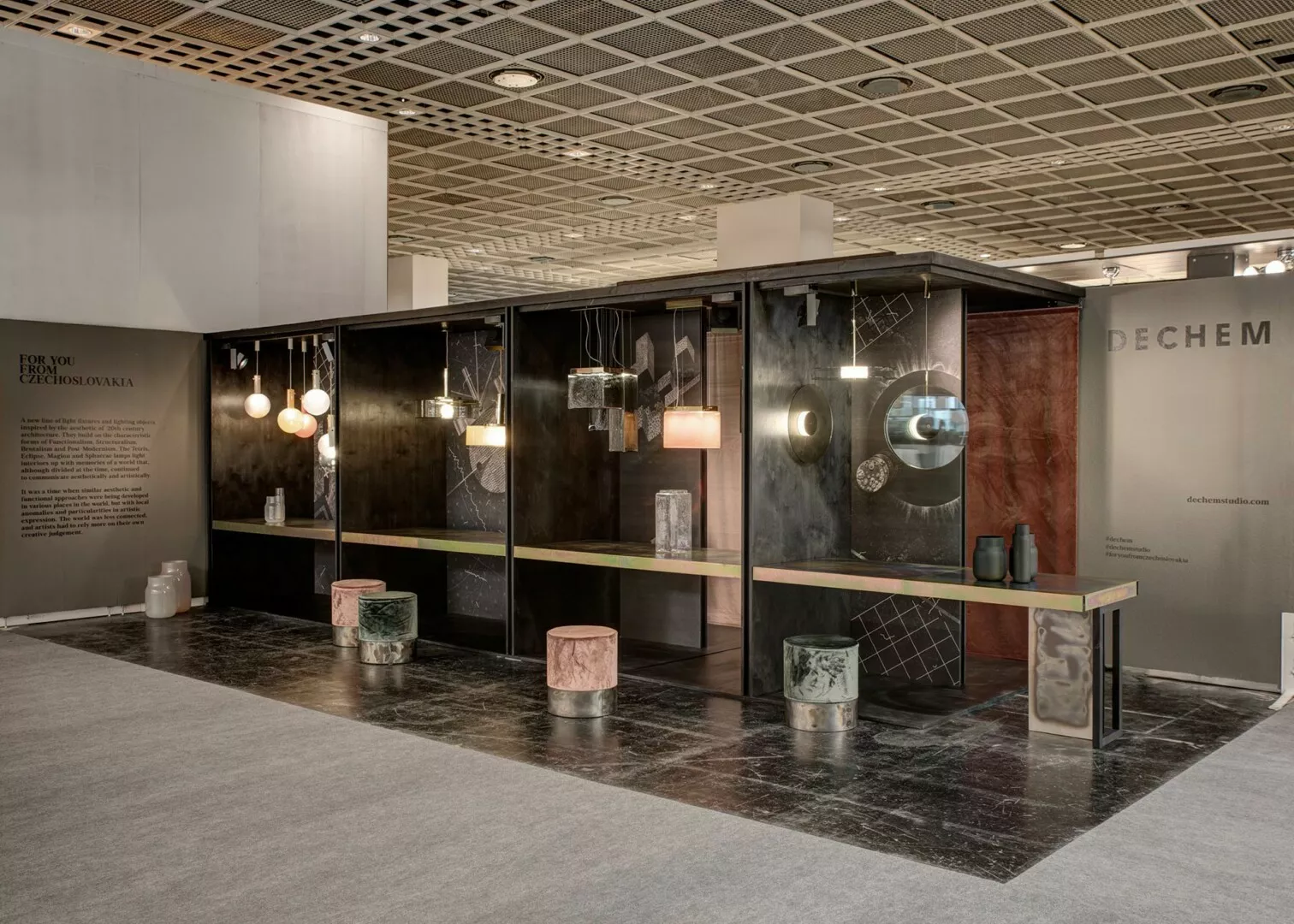Elegant interior design exhibit with lighting and furniture display.