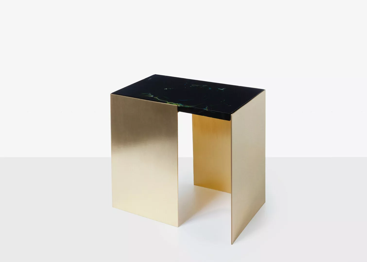 Modern gold and black marble minimalist table.