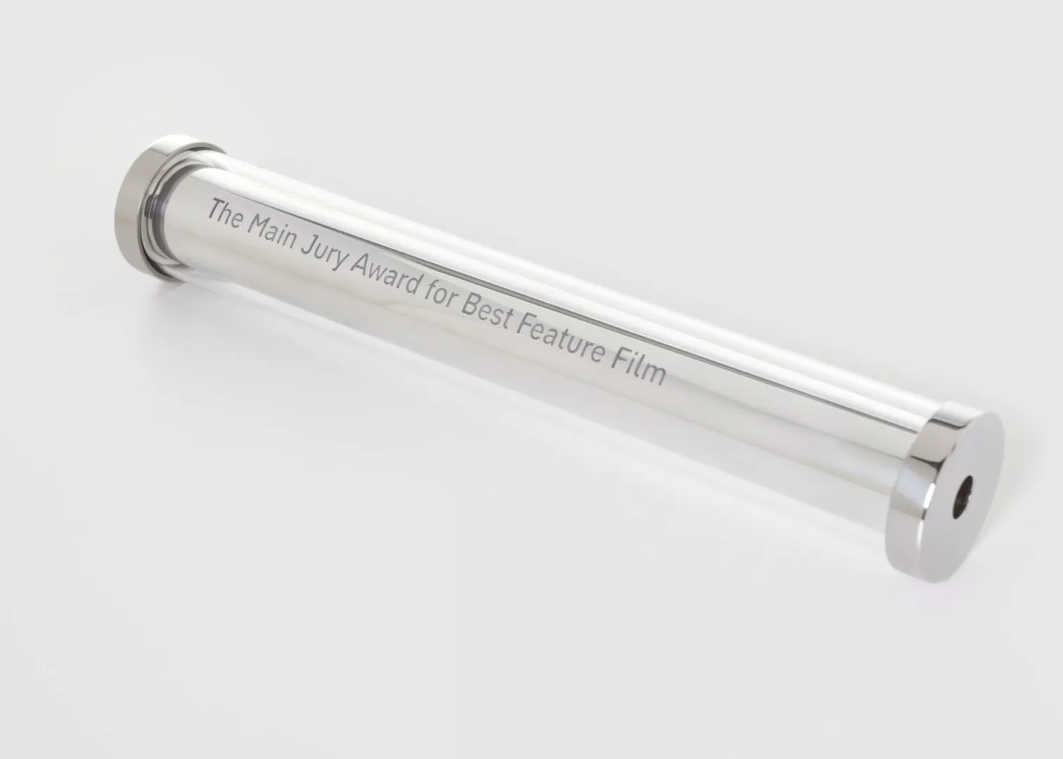Film award trophy engraved 'Main Jury Award for Best Feature.'