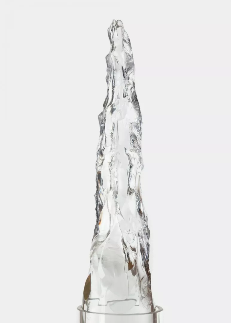 Clear crystal ice sculpture on white background.