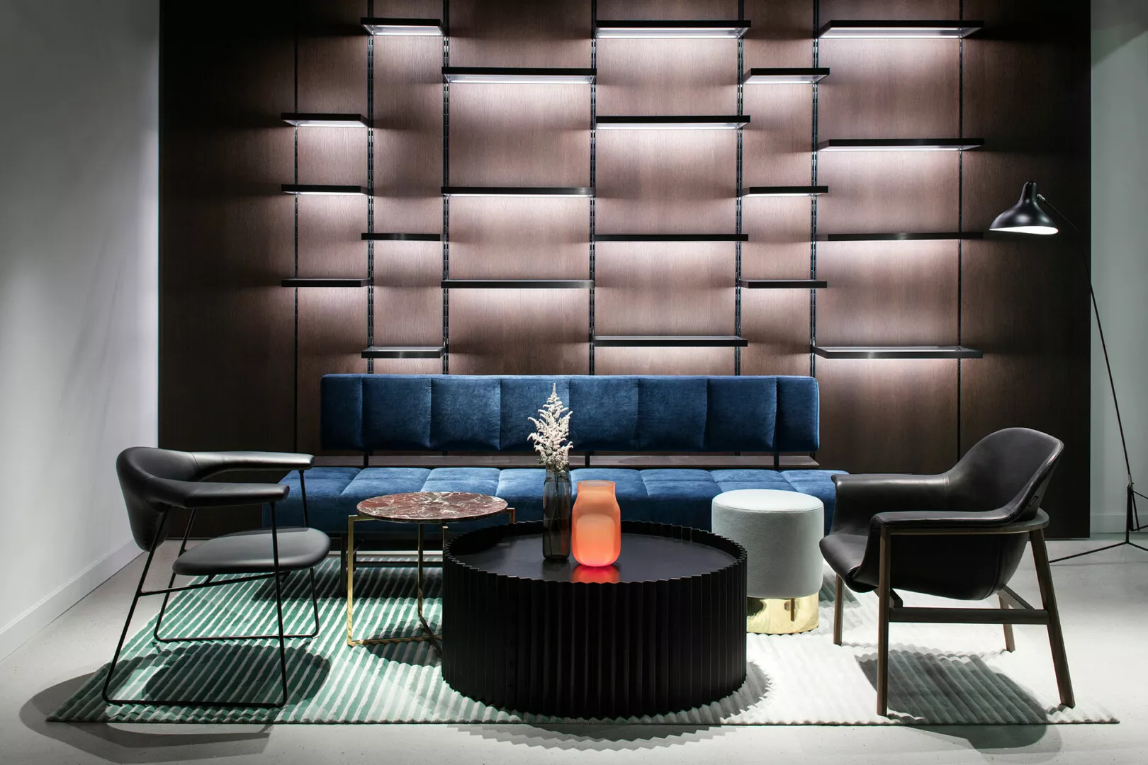 Modern living room with stylish furniture and wall panels.