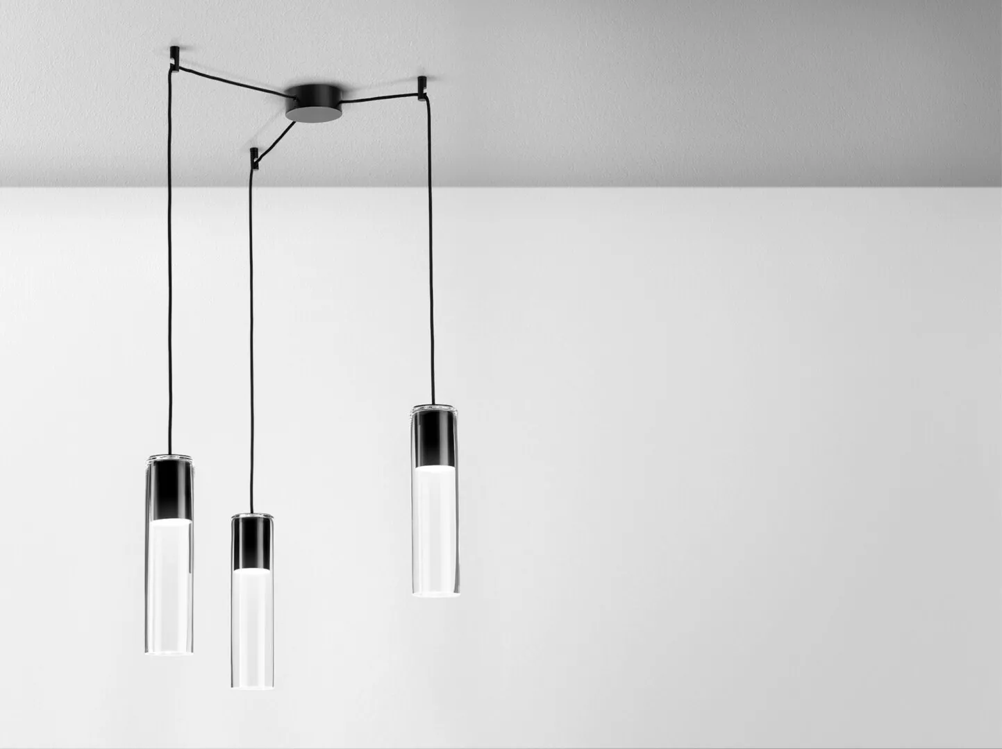 Modern hanging pendant lights on white ceiling