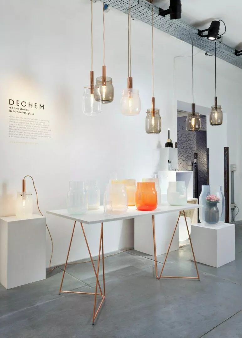 Modern glassware display with elegant hanging lights.