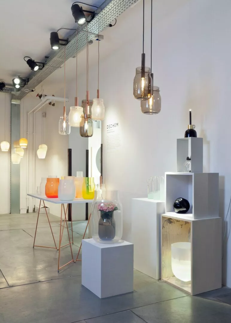 Modern lighting and glassware in chic minimalist showroom.