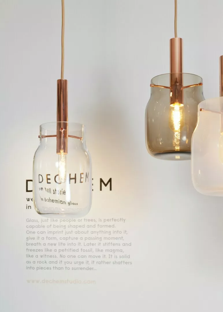 Modern copper pendant lights with translucent glass shades.