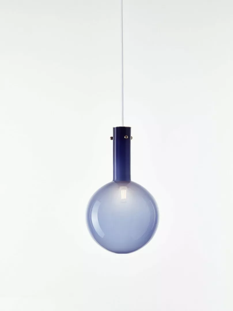 Modern blue pendant light hanging against white background.
