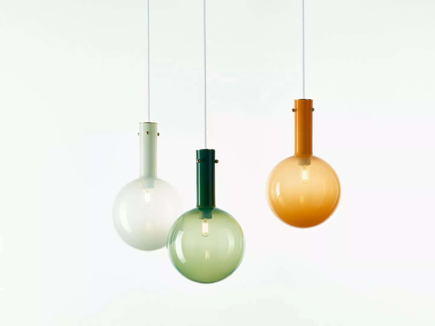 Three colorful hanging pendant lights, modern interior design.