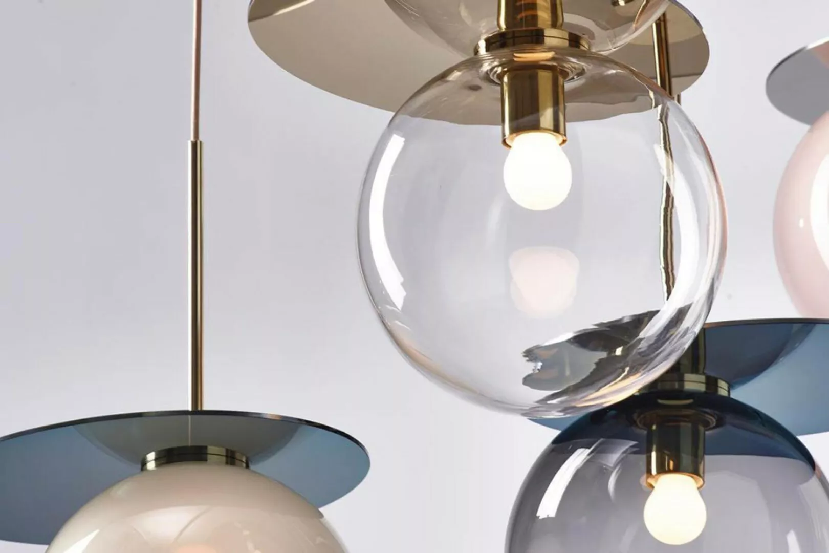 Modern pendant lights with brass accents.