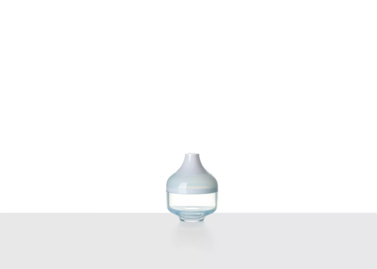 Clear glass essential oil diffuser on white background