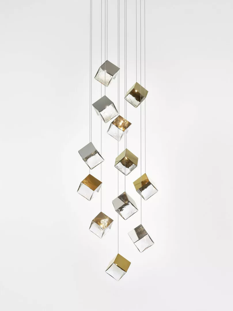 Modern hanging cube lights with metallic interiors.