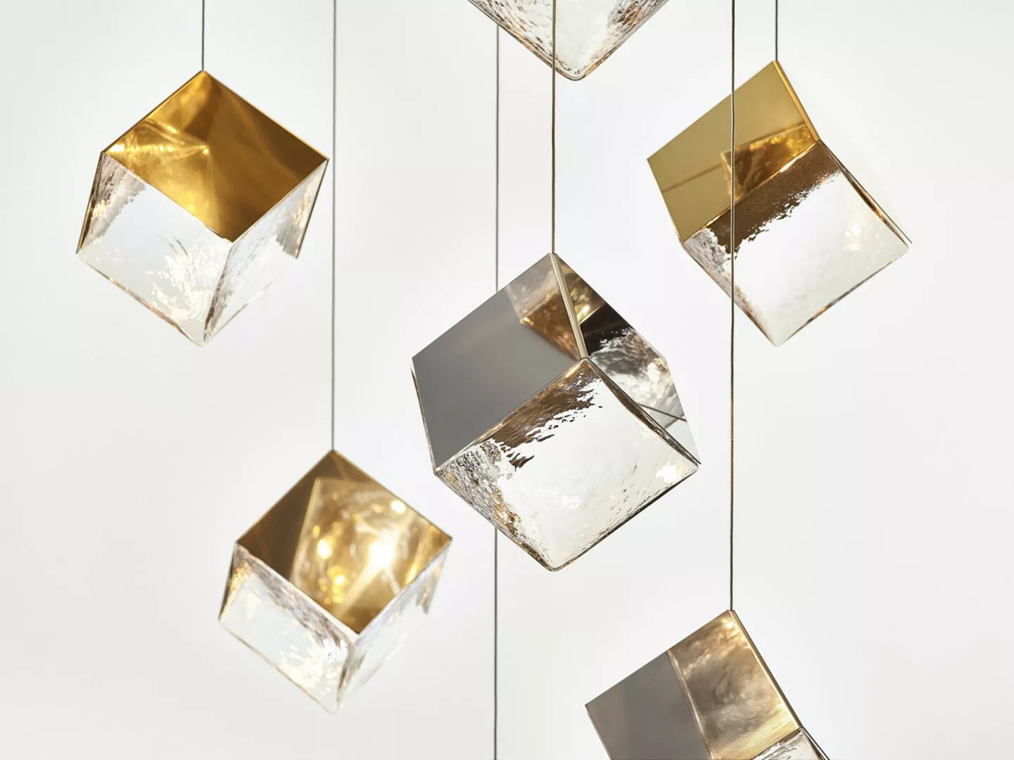 Modern gold and silver cube pendant lights.