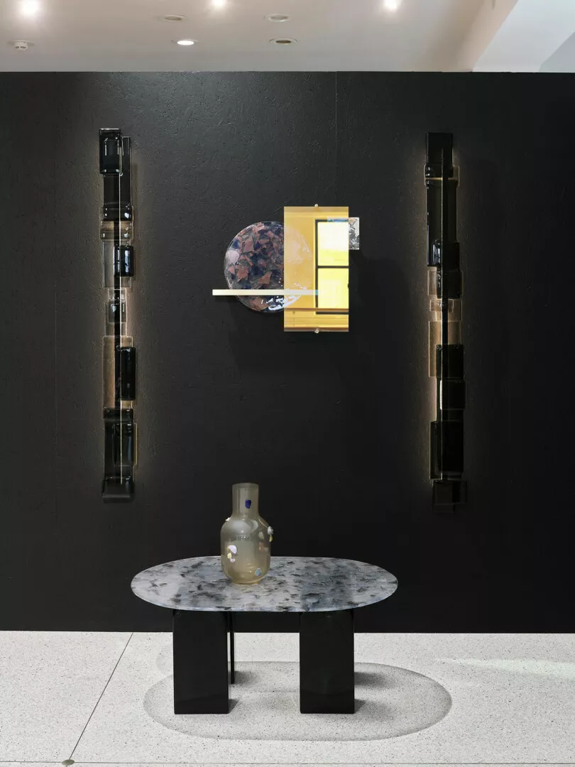 Modern furniture display in minimalist black and white decor.