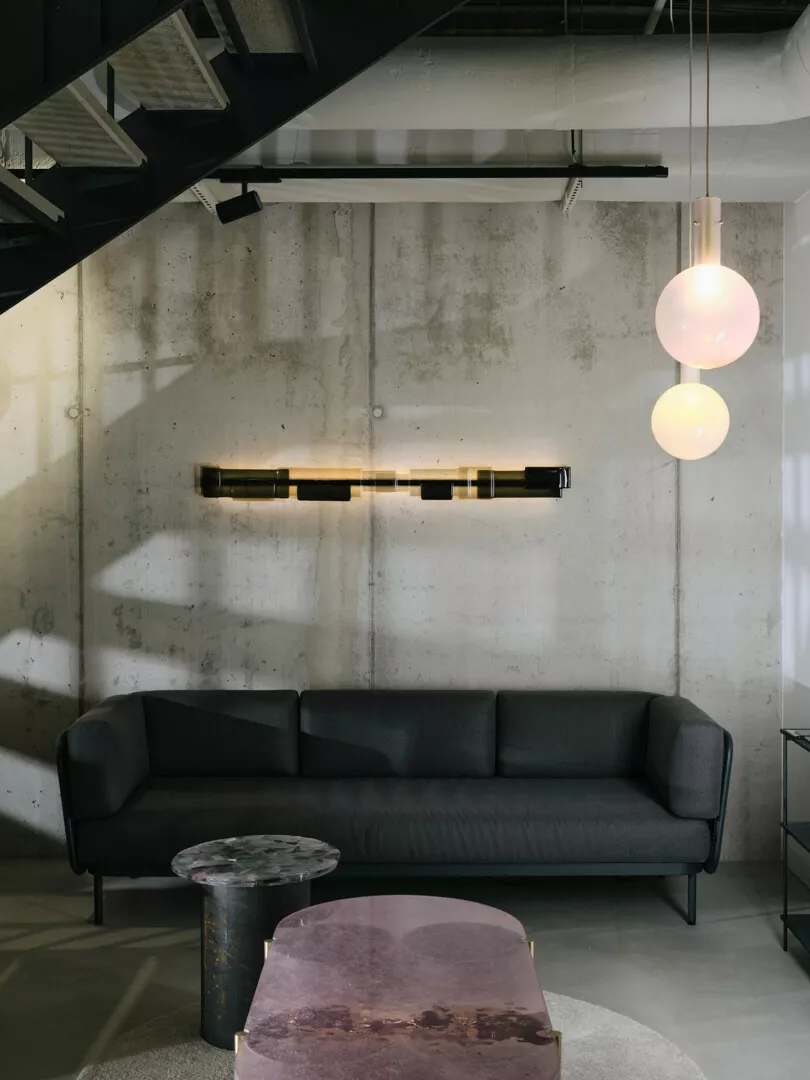 Modern industrial living room with chic furniture and lighting.