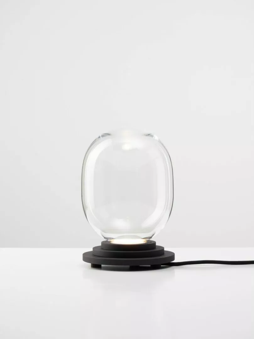 Modern glass sphere lamp on white background.